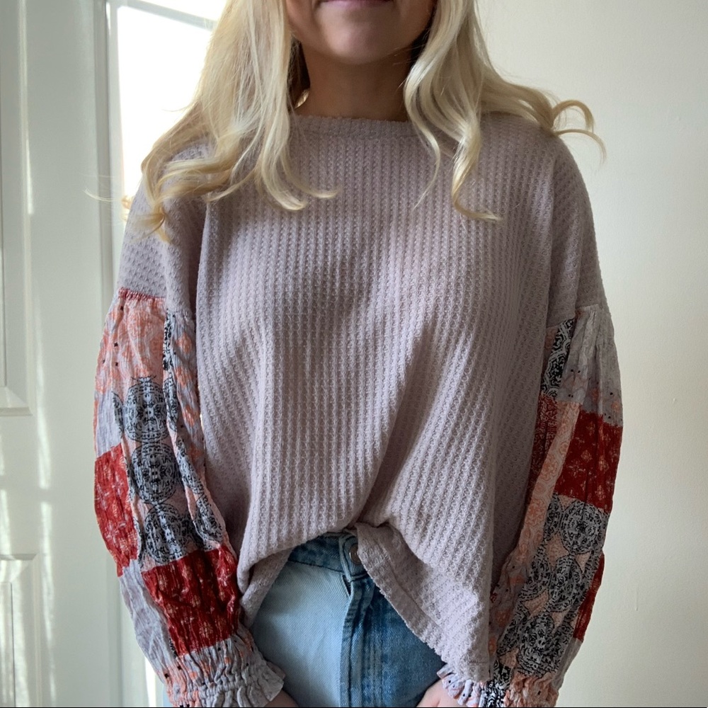 Cute flowy top with patterned sleeves